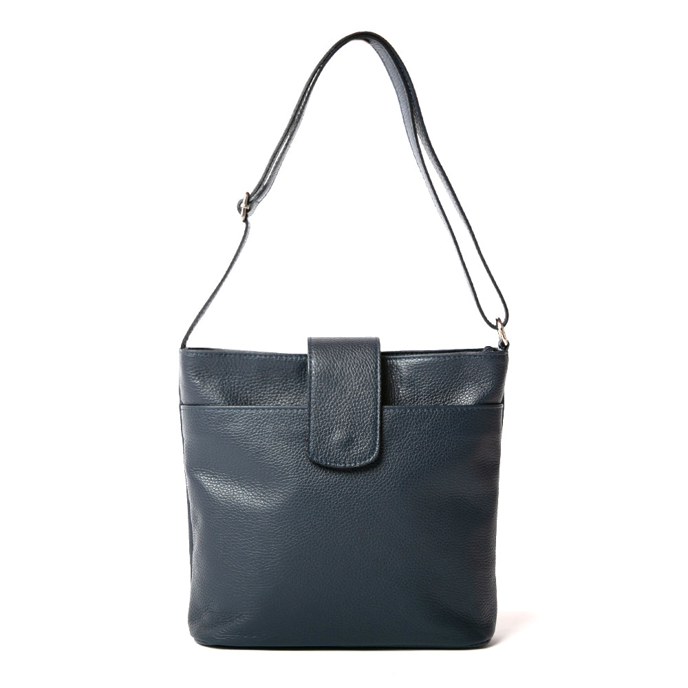 Pimlico Handbag in navy blue, shown from the front and including the adjustable leather strap, the fold over presstud fastening and the outside pocket. Made from Italian leather.