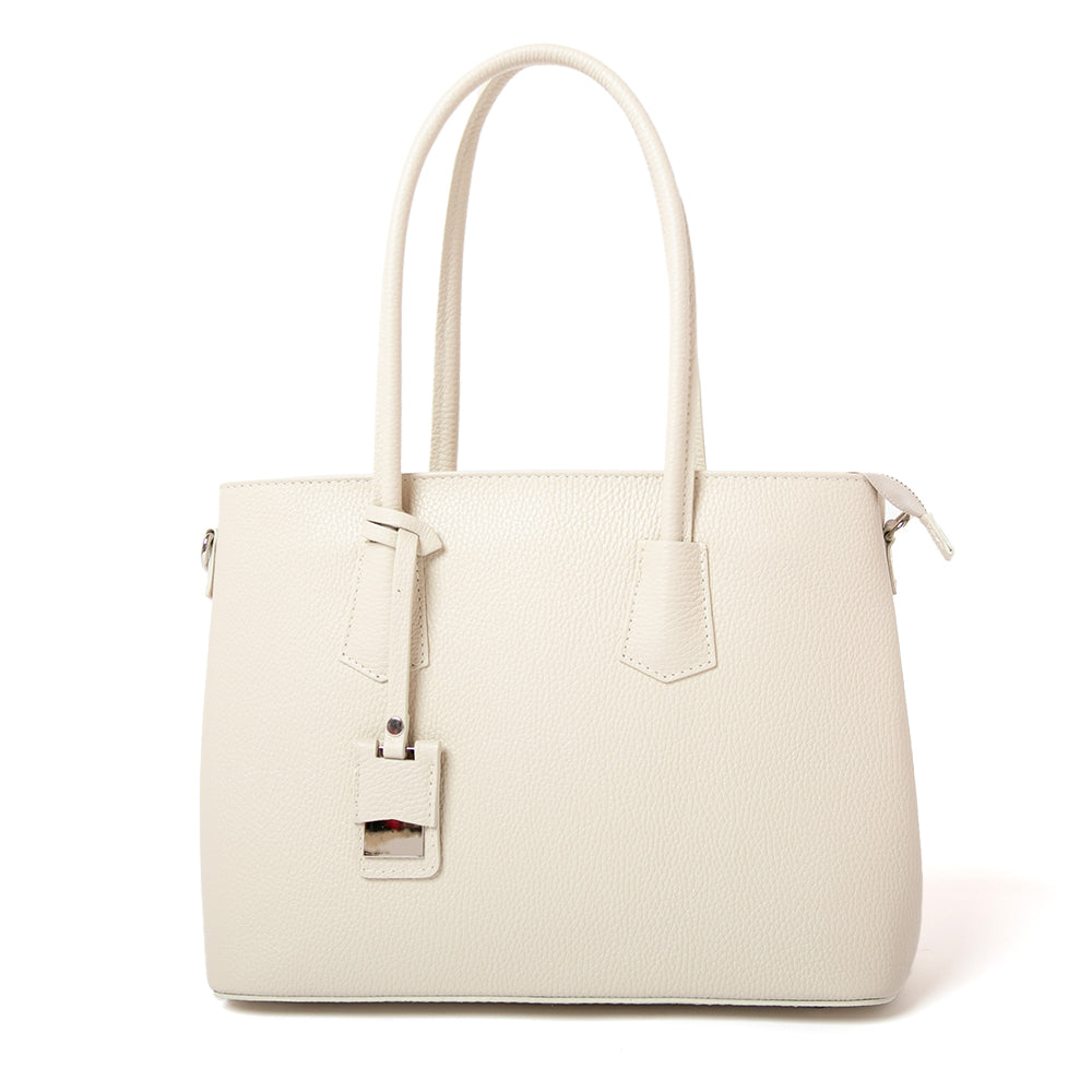 Cream Richmond Leather handbag in a tote bag style with a leather charm on the front