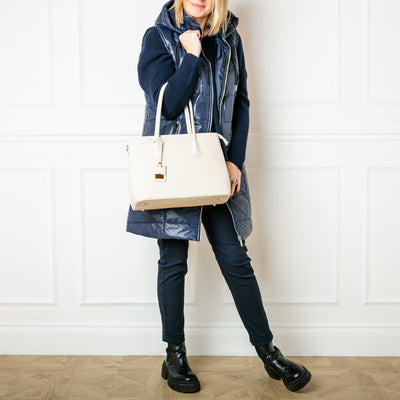 Our Richmond leather handbag being modelled paired with our Short Puffer Gilet and Stretch Trousers