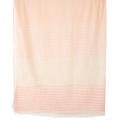 The Sandy Scarf in pink featuring a striped pattern of different sizes and widths