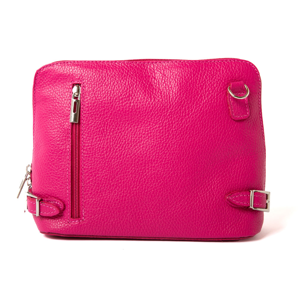 Italian leather Sloane Handbag, shown from the front in bright fuchsia pink, including the adjustable leather strap, three side zip fastening, buckle detail and the outside pocket. 