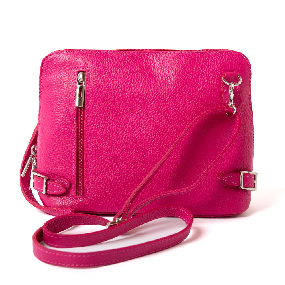 Italian leather Sloane Handbag, in bright fuchsia pink. Three side zip fastening, buckle detail and the outside pocket. Extended adjustable strap shot