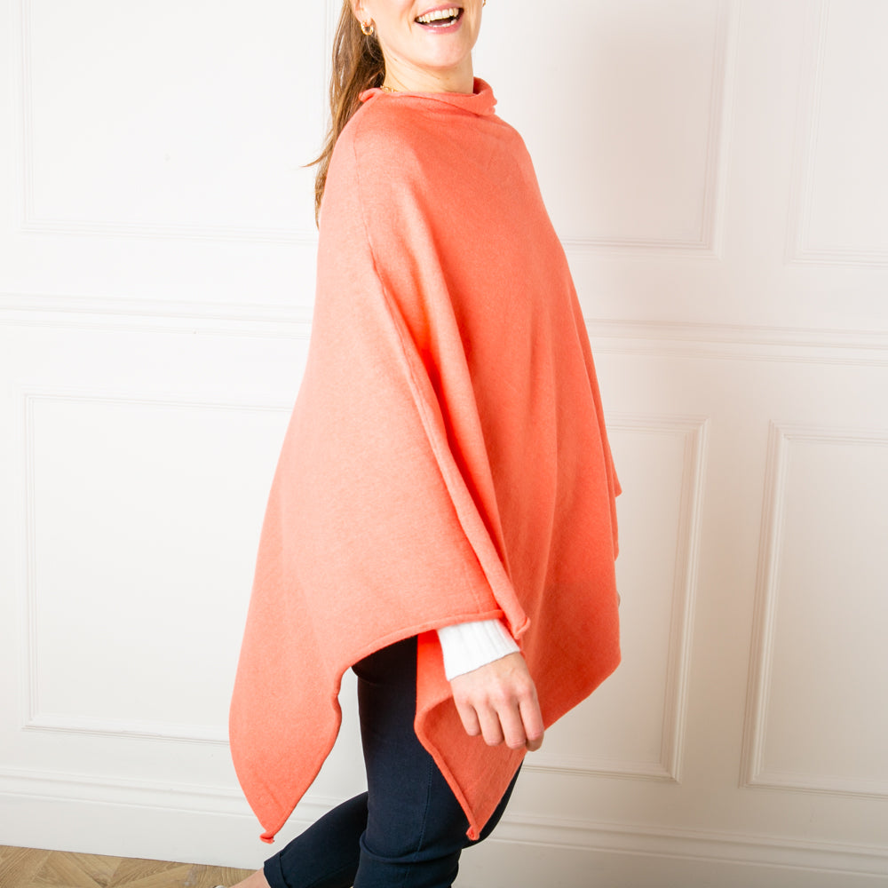 Tilley poncho in Coral, super soft, high neck, waterfall shape, easy to wear, multiple ways to style