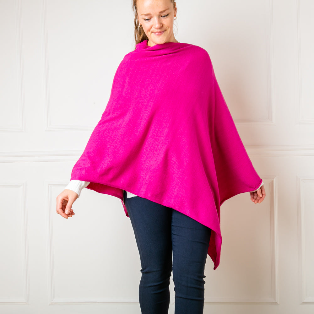 Tilley poncho in Fuchsia, super soft, high neck, waterfall shape, easy to wear, women's outerwear, women's ponchos, dress up or wear for a casual every day outift.