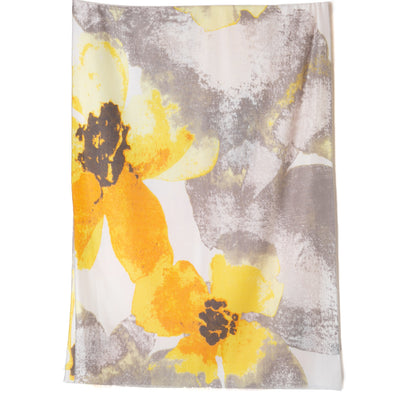 The Tokyo Scarf in yellow featuring an oversized floral pattern