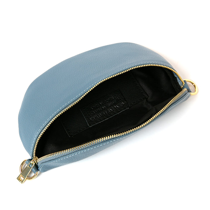 Open shot of the Winchester Leather handbag in Denim blue, gold hardware, adjustable bag strap, soft blue tone.